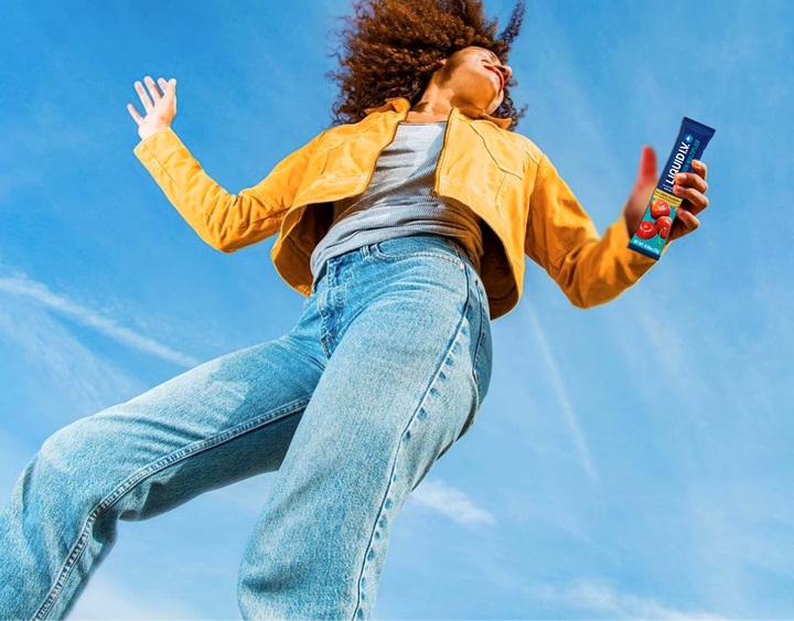 The girl holding the Liquid IV product